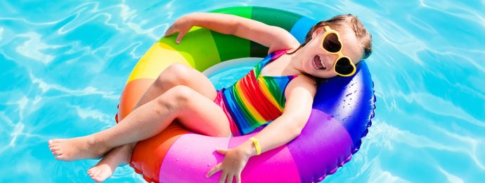 Child With Toy Ring In Swimming Pool