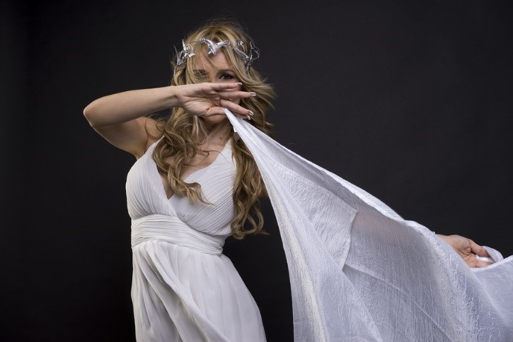 A woman dressed up as the greek god Aphrodite.