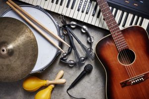 Guitar, drums, keyboard, and other instruments together.
