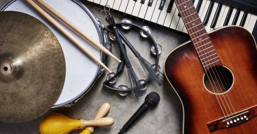 Guitar, drums, keyboard, and other instruments together.