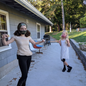 DeAngelis Students playing outside in masks.