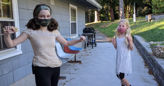 DeAngelis Students playing outside in masks.